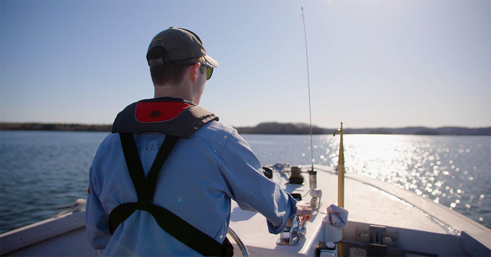 Student driving a boat