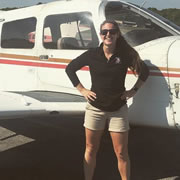 Kylie in front of plane