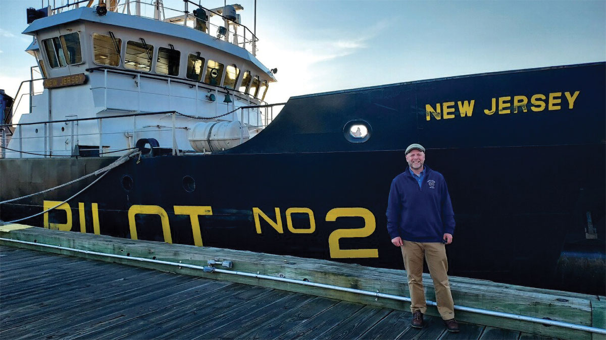 Ron Perry in front of tug