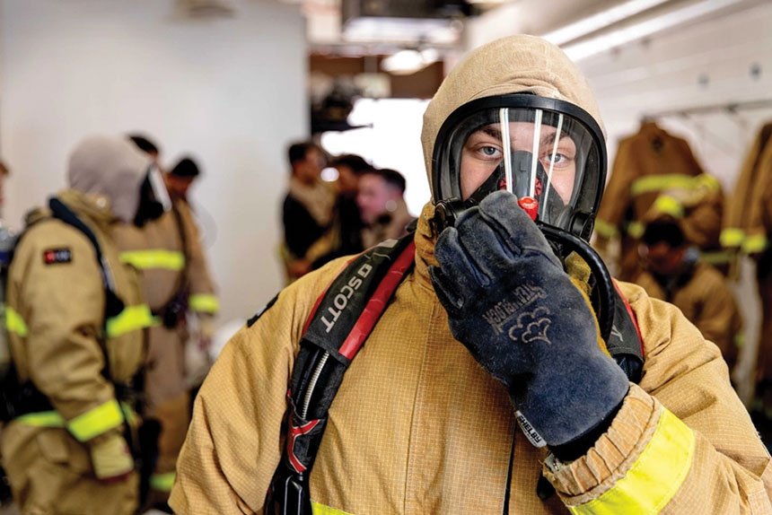 Student in firefighting equipment