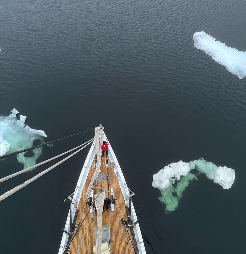 Bowdoin sailing with icebergs