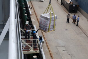Crane loading stores.