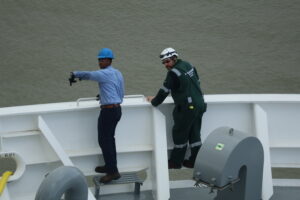 Cadet and chief mate conducting hand signals