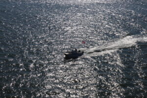 Boat escorting us in