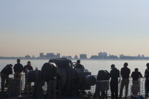 City Passes along the port side of the ship.