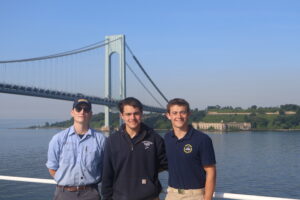 Cadets posing with bridge in background