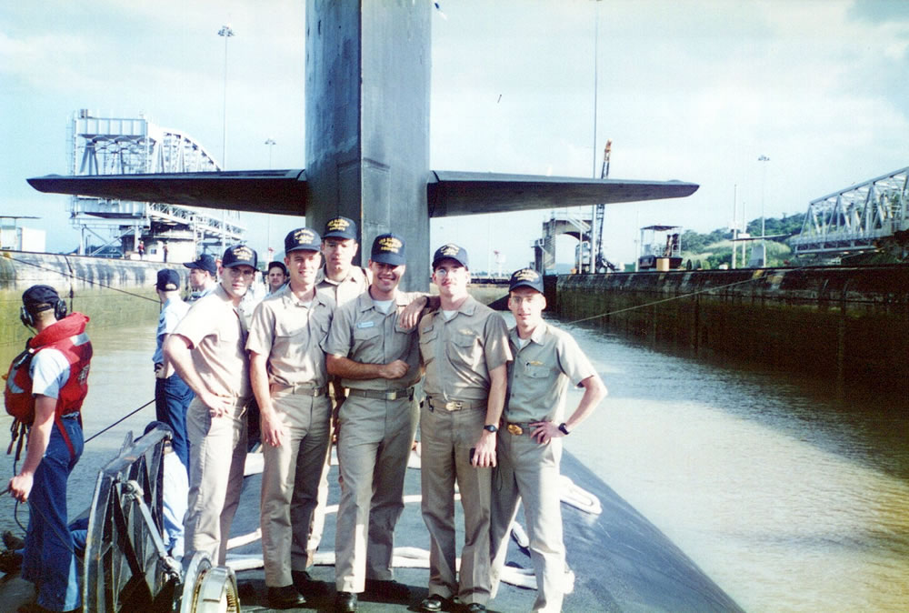 Officers on deck as they travel through the Panama Canal