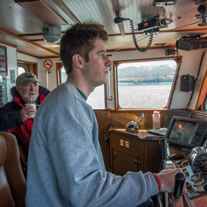 Student driving tug